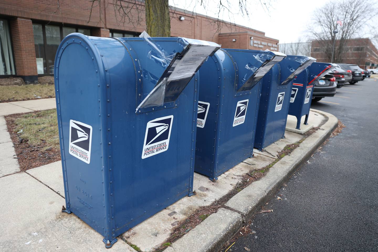 Out of Service notices are taped on the mail boxes outside the McDonough Street Post Office. Joliet police have investigated mail theft and burglary at the McDonough Street Post Office that is under investigation by U.S. Postal Service.