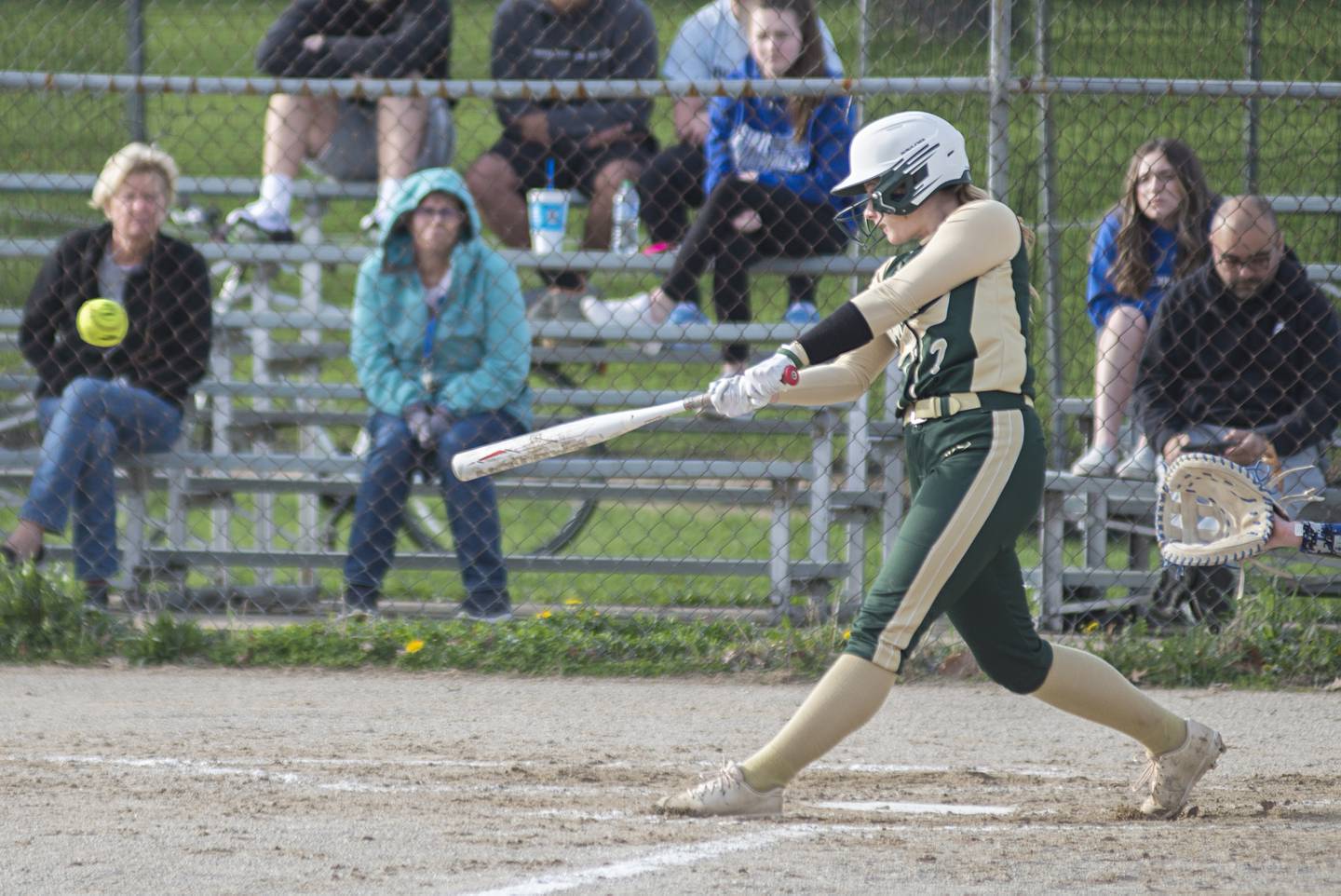 St. Bede’s Grace Maschmann drives the ball into the gap against Newman Wednesday, May 4, 2022.