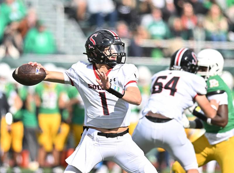 Springfield's Brody Scheffler (1) looks to throw a pass during the class 5A first round playoff game against Providence Catholic on Saturday, NOV. 01, 2025, at New Lenox.