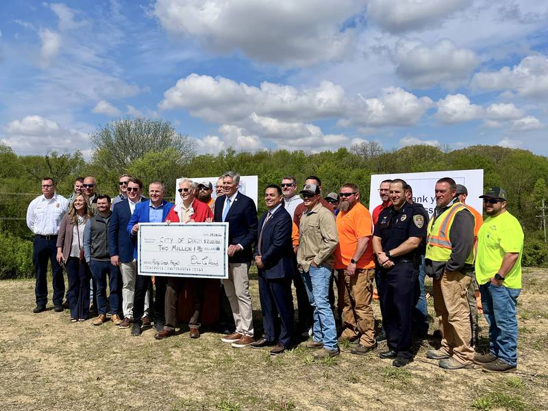 Dixon city and state officials hold up the $2 million check on Friday, May 8, 2026. The city was awarded that amount of federal funding for the creation of retention ponds to the west of Dixon’s major economic development near Interstate 88.