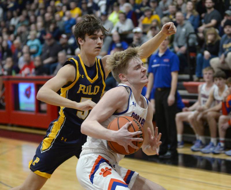 Eastland's Trevor Janssen (11) protects the ball from Polo's Gus Mumford (5) on Friday, Feb. 23, 2024 during the 1A Forreston Regional championship game at Forreston High School.