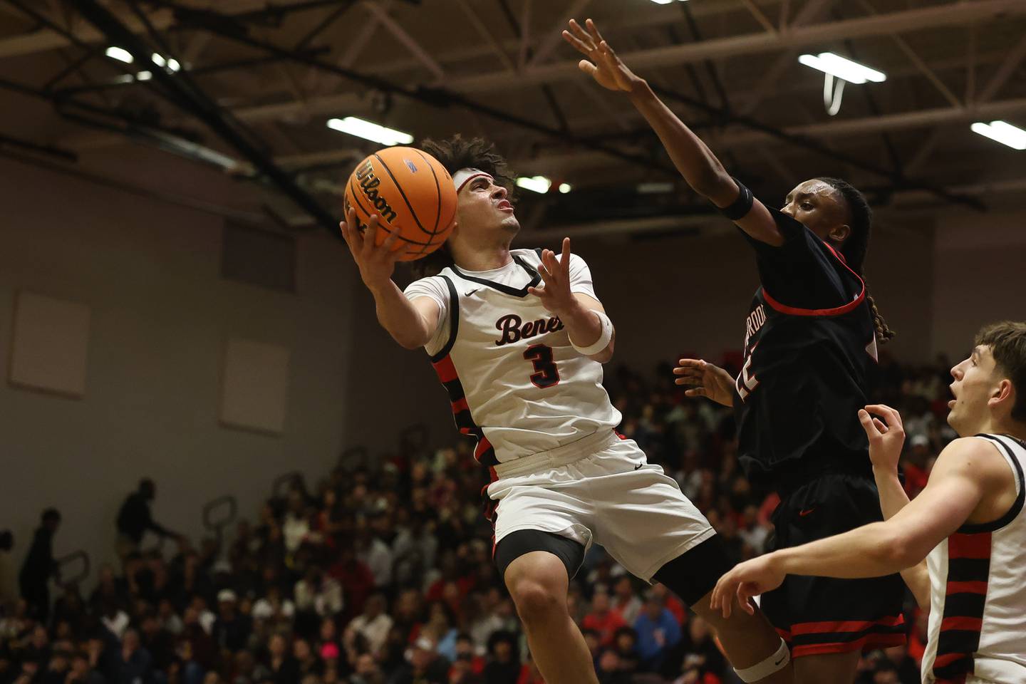 Benet’s Jayden Wright finesses a shot against Bolingbrook in the Class 4A Bolingbrook Sectional championship game on Friday, March 6, 2026 in Bolingbrook.