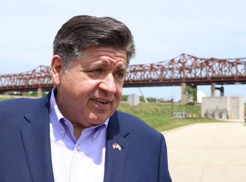 Governor JB Pritzker talks with a guest at the construction kickoff for the new Interstate 80 Des Plaines River bridges on Friday, May 20, 2026 in Joliet.