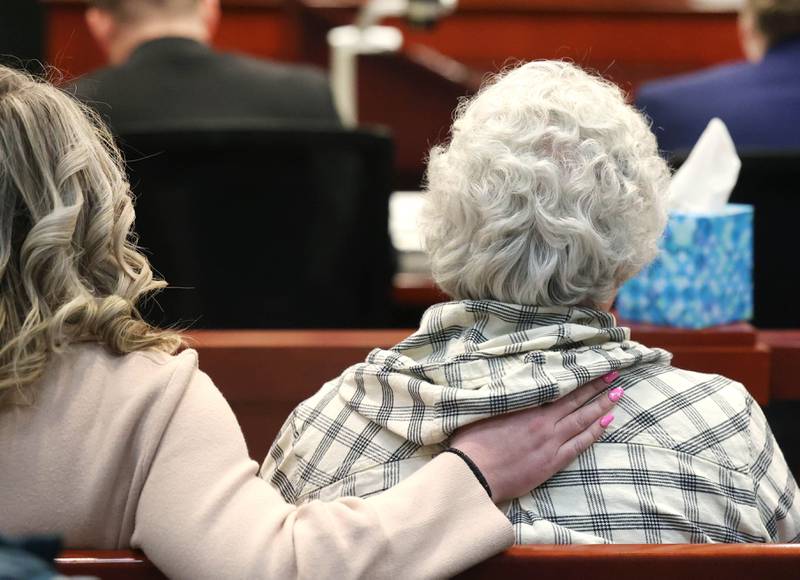 Sue Saari (right) daughter of Patricia Wilson and sister of Robert Wilson is comforted Thursday, Jan. 30, 2025, at the DeKalb County Courthouse, after Jonathan D. Hurst was found guilty of the 2016 murders of Patricia and Robert.