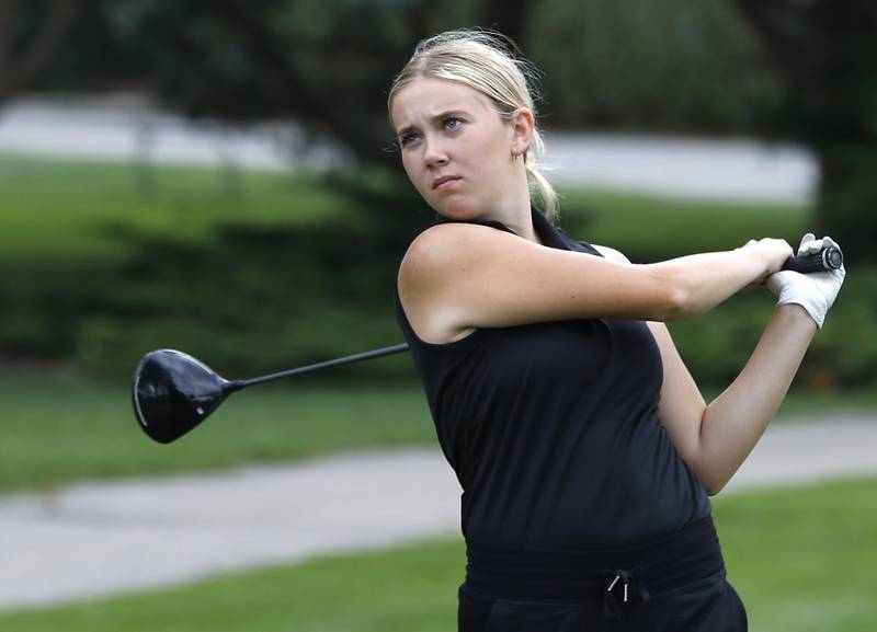 McHenry’s Abby Powers watches her tee shot on the 1st hole during the Fox Valley Conference Girls Golf Tournament Wednesday, Sept. 24, 2025, at Crystal Woods Golf Club in Woodstock.