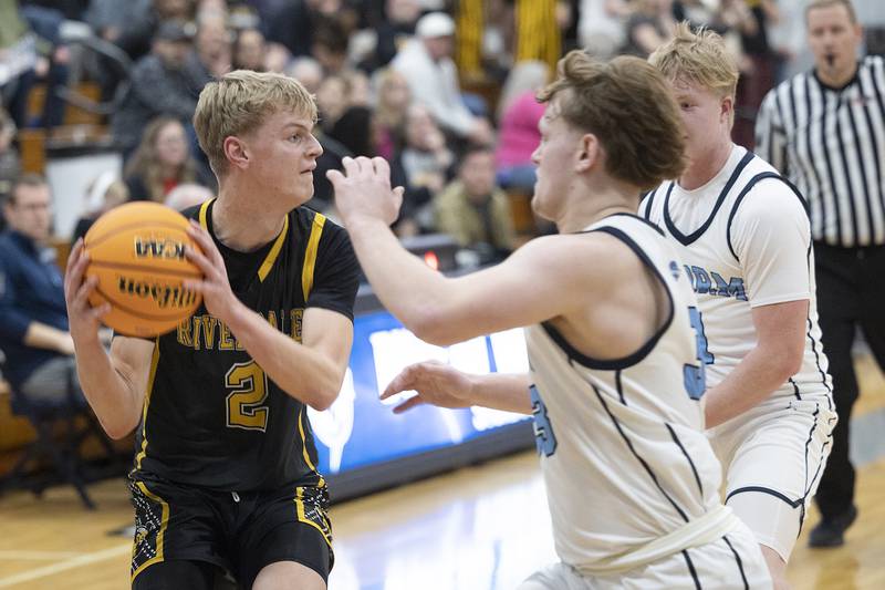 Riverdale’s Jackson Tegeler looks to pass while being defended by Bureau Valley’s Elijah Endress Wednesday, Feb. 26, 2025, at the Class 2A Regional semifinal at Bureau Valley High School.