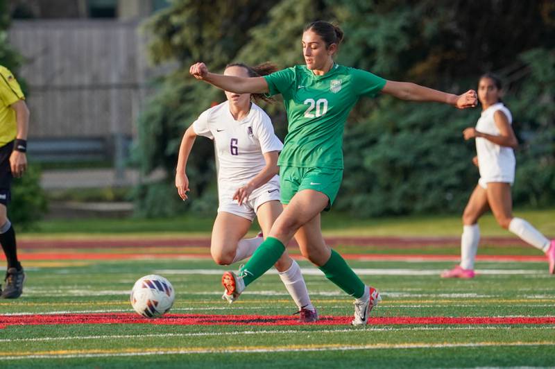 York’s Mia Barton (20) plays the ball against Downers Grove North's Karly Harkness (6) during a Class 3A Hinsdale Central Sectional semifinal soccer match at Hinsdale Central High School in Hinsdale on Tuesday, May 21, 2024.