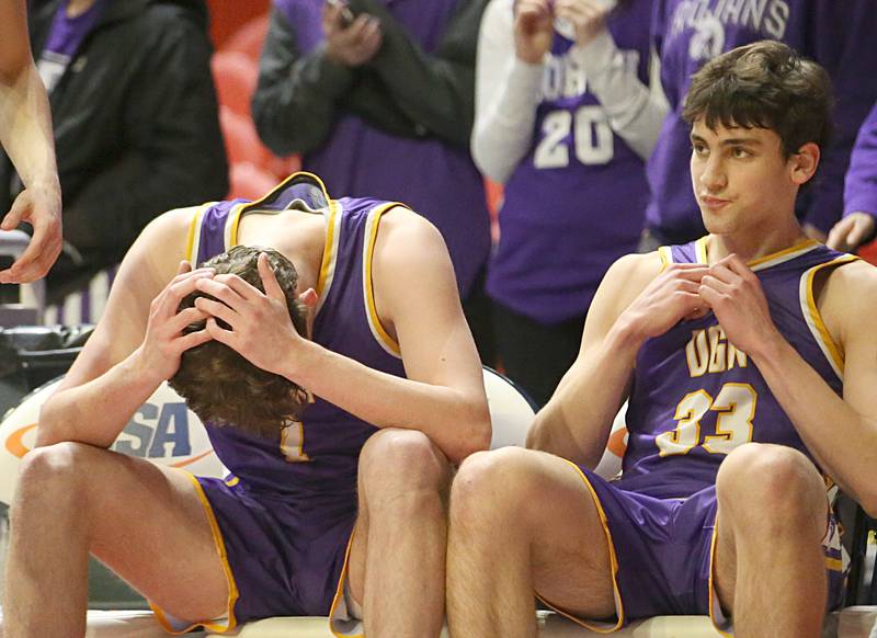 Downers Grove North's Jake Riemer and Finn Kramper react after loosing to New Trier in the Class 4A state third place game on Friday, March 10, 2023 at the State Farm Center in Champaign.