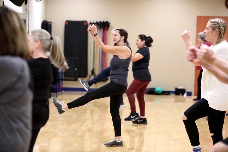 Joan Bry teaches a fitness class for active older adults at Ackerman Sports and Fitness Center in Glen Ellyn on Friday, Jan. 5, 2024.