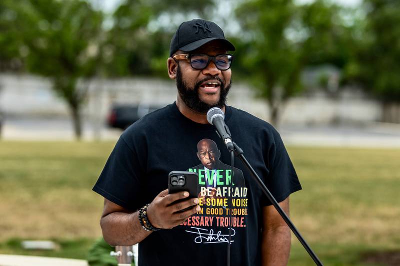 Pastor DeAndre Robinson of New Beginnings Church speaks to attendees during the Good Trouble Lives On event in Downtown Joliet on July 17, 2025.
