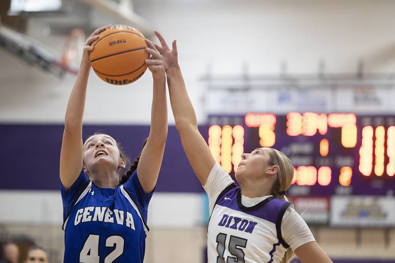 Geneva’s Adelyn Estabrook pulls down rebound against Dixon’s Morgan Hargrave Thursday, Feb. 19, 2026, in the Class 3A girls basketball regional title game.