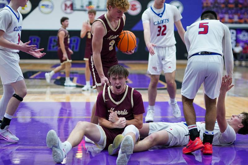 Morris’ Brett Bounds (22) reacts after scoring on a foul by Marmion’s Brendan Kavanaugh (14) during a basketball game in the opening round of the 61st annual Plano Christmas Classic at Plano High School on Monday, December 23, 2024.