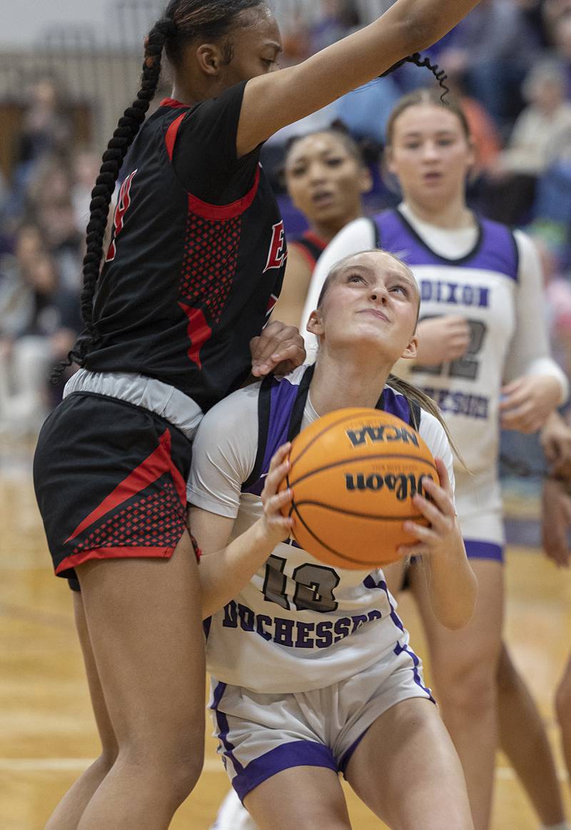 Dixon’s Addy Lohse looks to put up a shot against Rockford East’s J’Lynn Sims Monday, Feb. 16, 2026.