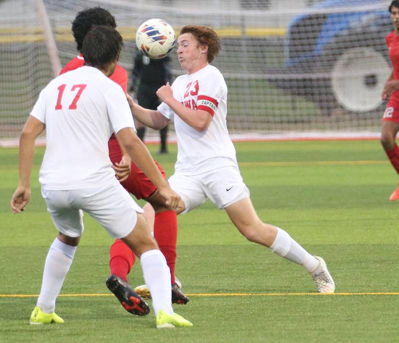 Ottawa's Evan Snook keeps the ball away from L-P's Brayan Gonzalez while teammate Alan Sifuentes helps out on Monday, Sept. 11, 2023 at the L-P Athletic Complex in La Salle.