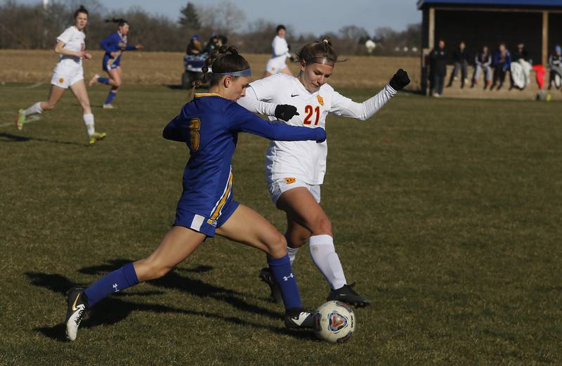 Richmond-Burton’s Blake Frericks (right) tries to take the ball from Johnsburg’s Elizabeth Smith during a Kishwaukee River Conference soccer game on Wednesday, March 20, 2024, at Johnsburg High School.