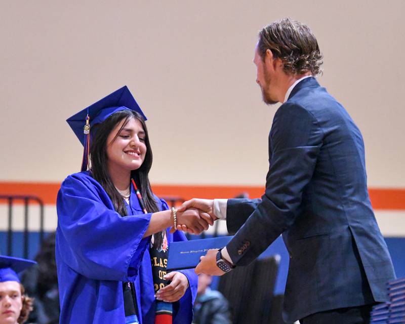 Genoa-Kingston senior Anna Martinez smiles as she receives her diploma during her graduation ceremony held Saturday May 18, 2024, at Genoa-Kingston High School, 980 Park Ave., Genoa.