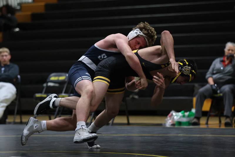 Plainfield South’s Kyle McCormick drops Joliet West’s Kevin Lozano in the 150 pound match Wednesday, Dec. 3, 2025 in Joliet.