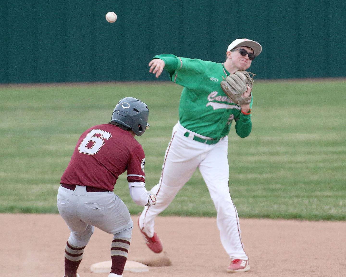 L-P's Brandon Foreman fires to first after forcing out Morris's Anthony Xydakis on Wednesday, April 17, 2024 at Huby Sarver Field inside the L-P Athletic Complex in La Salle.