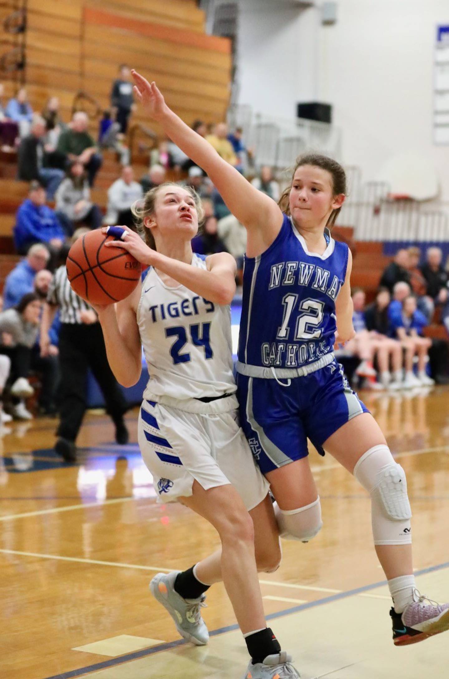 Princeton's Keighley Davis tries to get a shot off against Newman's Lucy Oetting Monday night at Prouty Gym.