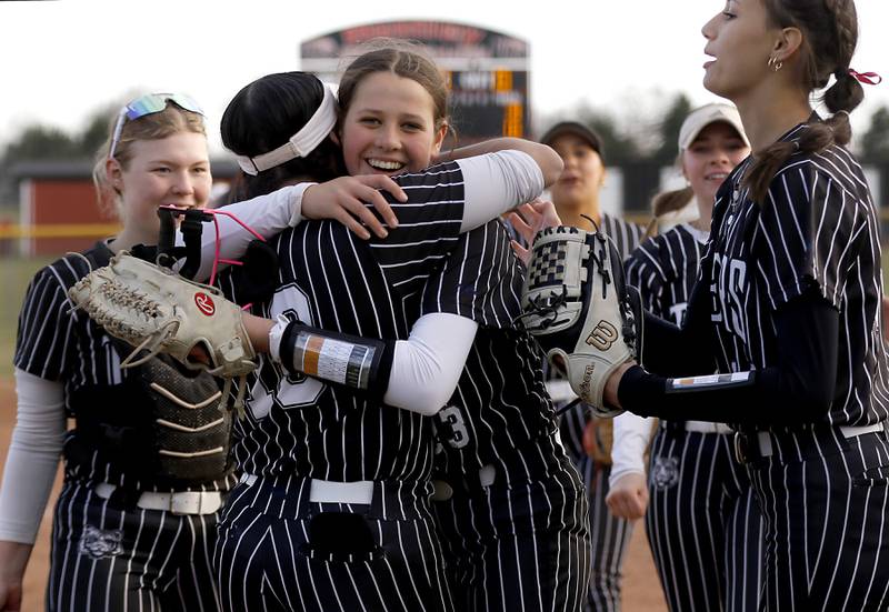 Crystal Lake Central's Oli Victorine hugs Liv Shaw after Crystal Lake Central defeated Huntley in a Fox Valley Conference softball game on Tuesday, April 8, 2025, at Huntley High School.