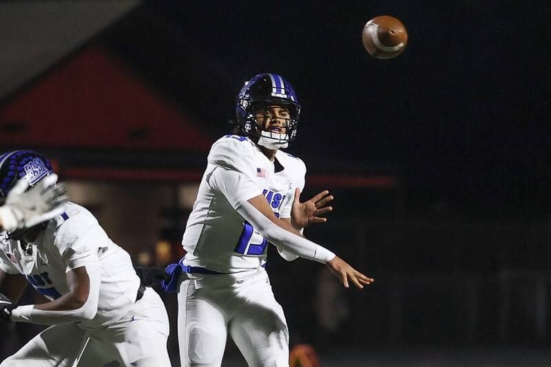 Lincoln-Way East’s Jonas Williams passes against Minooka on Friday, Nov. 8, 2024 in Minooka.