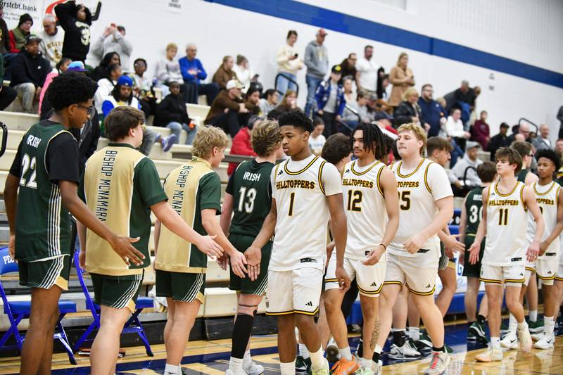 Joliet Catholic Academy's Jayden Armstrong leads his teammates through the handshake line following the Hilltoppers' 79-67 loss to Bishop McNamara in the IHSA Class 2A Peotone Sectional semifinal on March 4, 2025.