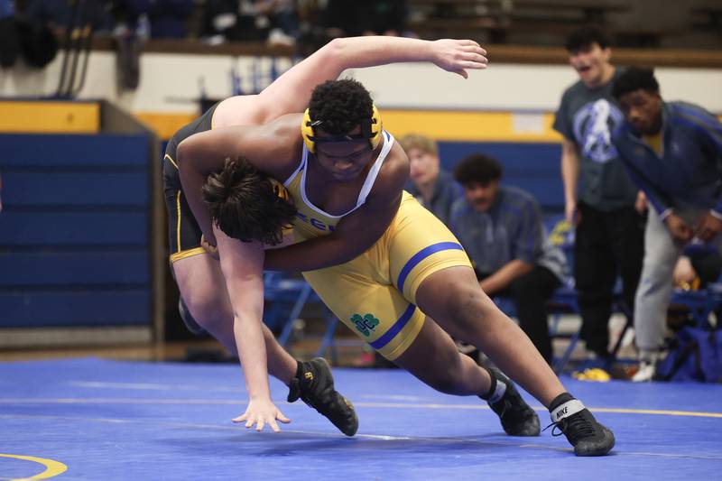 Joliet Central’s Evan Patton drops Joliet West’s Andre De Leon in the 285-pound weight match at Joliet Central on Friday, Jan 31, 2025.