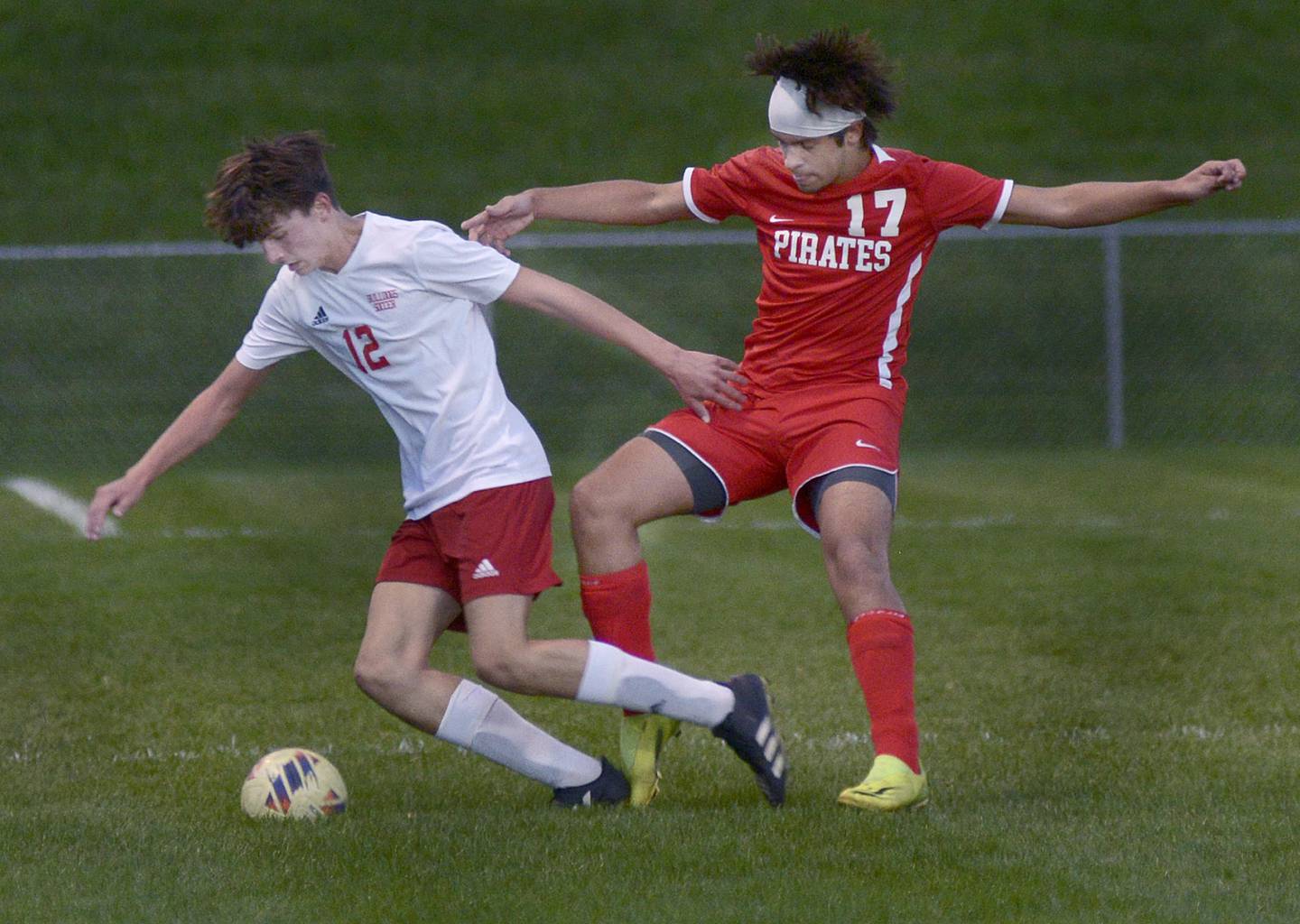 Streator’s Aaron Henson gets the ball past Ottawa’s Alan Sifuentes during the first half of Tuesday's match at Ottawa.