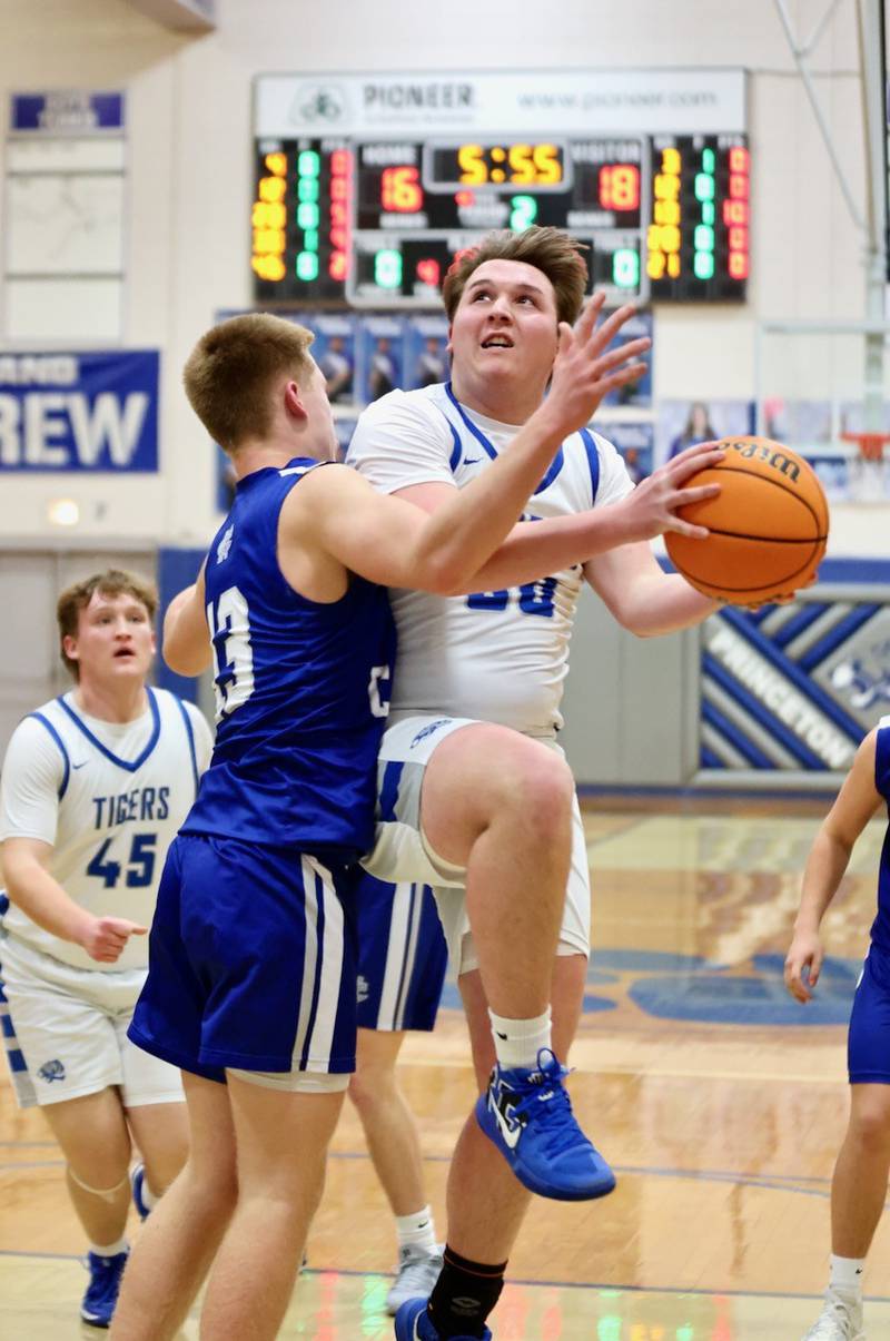 Princeton senior Jordan Reinhardt drives  Newman's Jordan Rowzee Friday night at Prouty Gym. The Tigers beat 60-46.