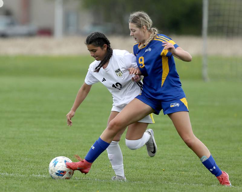 Harvard's Rosy González battles with Johnsburg's Brooke Butler for control of the ball during a Kishwaukee River Conference soccer match on Wednesday, April 27, 2026, at Johnsburg High School.
