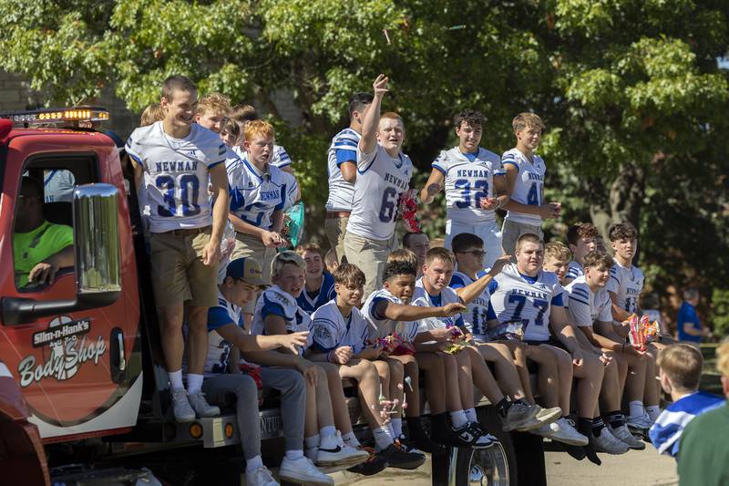 The Newman High School football team rides through the homecoming parade Friday, Sept. 20, 2024, in Sterling.