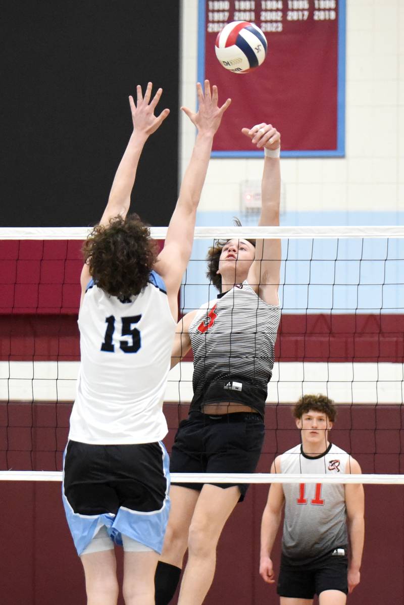 Bradley-Bourbonnais' Tate Marcotte, center, looks to place the ball over Kankakee's Eli Stipp, left, as fellow Boilermaker Jacob Berns obersves in the background during the All-City game at Kankakee Thursday, April 10, 2025.