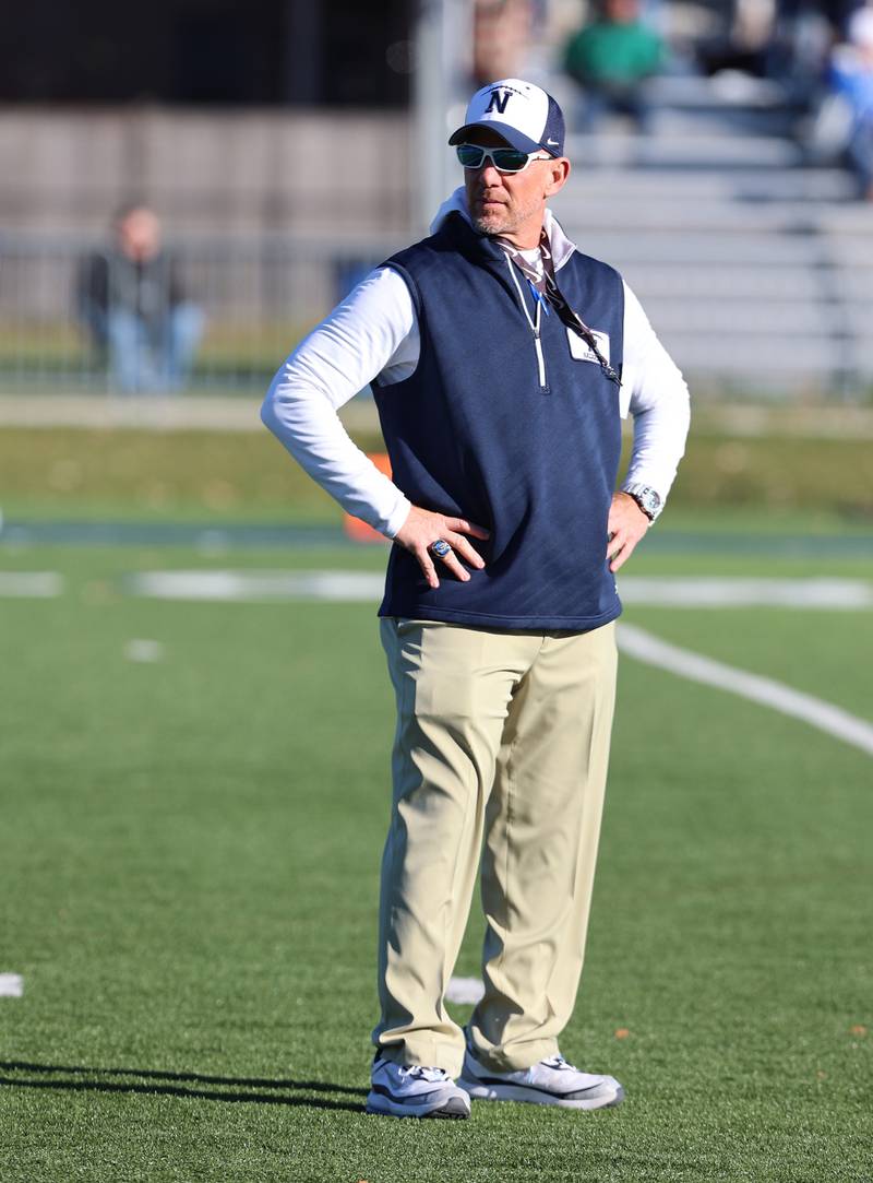 Nazareth coach Tim Racki watches pre-game warmups before the boys varsity IHSA 5A semifinal between Nazareth Academy and St. Francis high school in La Grange Park, IL on Saturday, Nov. 18, 2023.