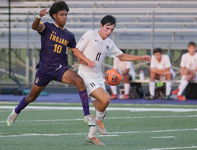 Mendota's Jasiel Watson (10) and Bloomington Central Catholic's Brad Torry (11) race to the ball on Wednesday, Sept. 14, 2022 in Mendota.