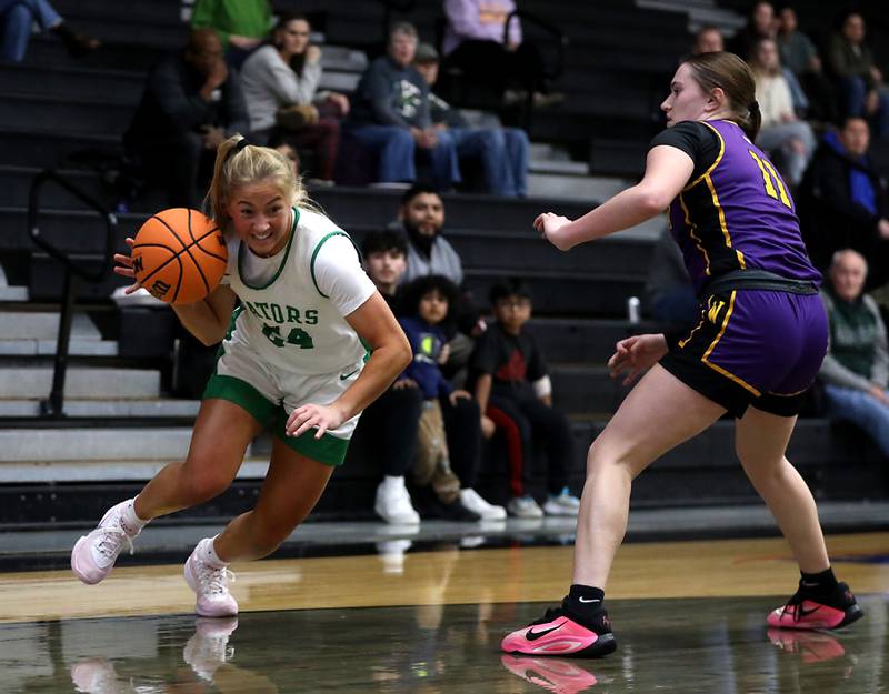 Crystal Lake South's Gracey LePage derives the baseline against Wauconda's Sophie Giles during the Northern Illinois Holiday Classic Championship girl basketball game on Thursday, Dec. 18, 2025, at McHenry High School.