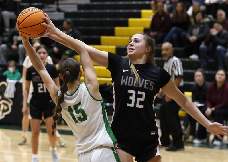 Prairie Ridge's Adella Pollack (right) tries to knock the ball away from Crystal Lake South's Tessa Melhuish during a Fox Valley Conference girls basketball game on Friday, Dec. 13, 2024, at Crystal Lake South High School.