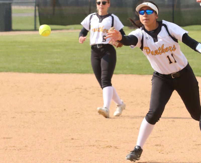 Putnam County's Valeria Villagomez tosses a ball to first base to force out a Henry-Senachwine runner on Tuesday, April 25, 2023 at Putnam County High School.