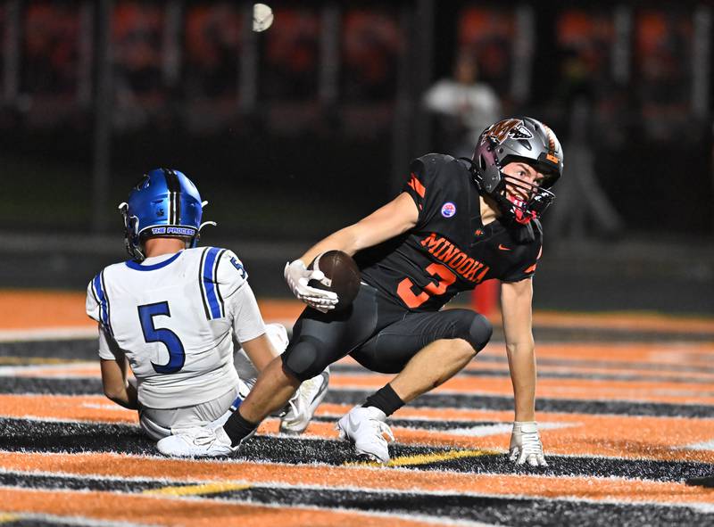 Minooka's Brady Hairald (3) catches a pass for a touchdown during the non-conference game against St. Charles North on Friday, Aug. 29, 2025, at Minooka.