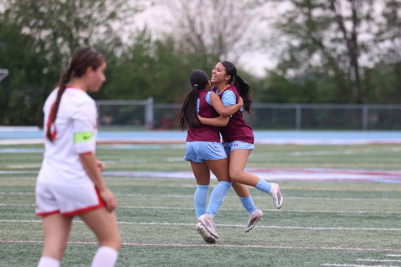 Kankakee's Jocelyn Sanchez, right, leaps in celebration of teammate Rachel Sanchez-Aguilar's goal on a direct kick during the Kays' 5-0 win against Blue Island Eisenhower in the Class 2A Kankakee Regional semifinals on Tuesday, May 19, 2026.