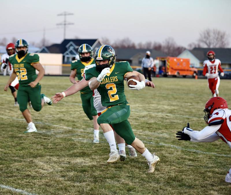 Coal City's Asa Cooper breaks through the Streator defense Friday night in a 48-0 win. Cooper scored four touchdowns.