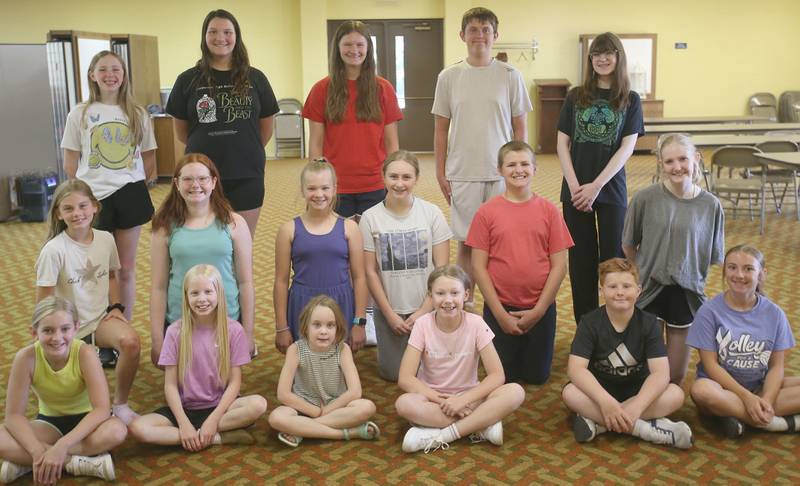 The cast of Annie Jr. poses for a photo during rehearsal for the upcoming musical Annie Jr. on Tuesday, June 24, 2025 at the First United Methodist Church in Henry. The show will be presented July 25-27 at the River Valley Players theater in Henry, .