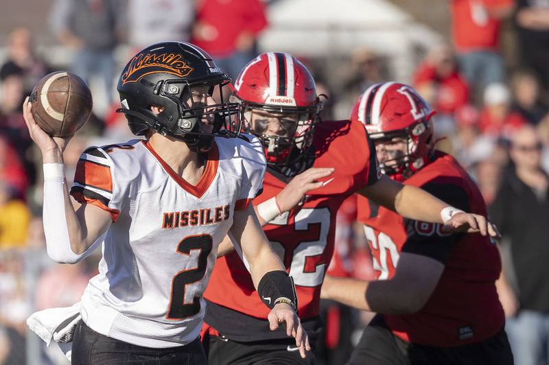 Milledgeville’s Kyson Francis flips a pass against Amboy Saturday, Nov. 15, 2025, in the 8-man football semifinal.