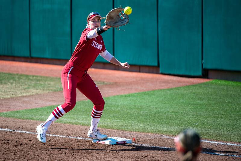 Emily Schultz catches an out during a game between Michigan and Stanford Softball at Boyd and Jill Smith Family Stadium on February 25, 2023 in Stanford, California. Schultz, a former Oswego East star, and Stanford will play in the College World Series this week.