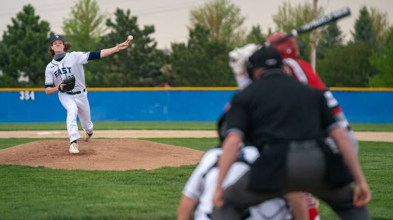 Oswego East's Noah Schultz (23) delivers a pitch against Yorkville during a high school baseball game in Oswego on Monday, May 3, 2021.