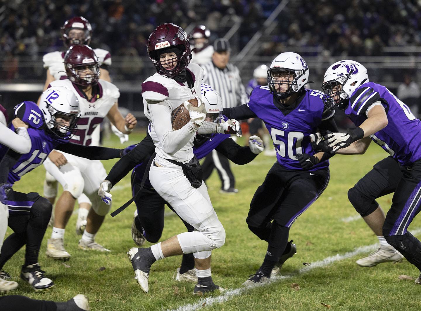 Marengo’s Gavin Bards looks for running room against Dixon Friday, Nov. 1, 2024 in the 4A football playoffs in Dixon.