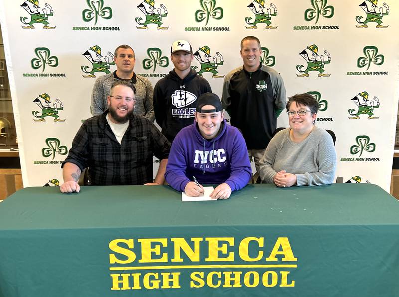 Seneca’s Casey Clennon has signed to continue his education at Illinois Valley Community College in Oglesby and his baseball career at the NJCAA level with the Eagles. Pictured here is Clennon, a slugger for the Fighting Irish and a unanimous first-team member of the 2024 Times All-Area Baseball Team, at his signing ceremony. From the left are: front row - Brandon Clennon, Casey Clennon, Jacey Clennon; back row - Seneca AD Ted O’Boyle AD, IVCC baseball coach Nick Harsted and Seneca baseball coach Tim Brungard.