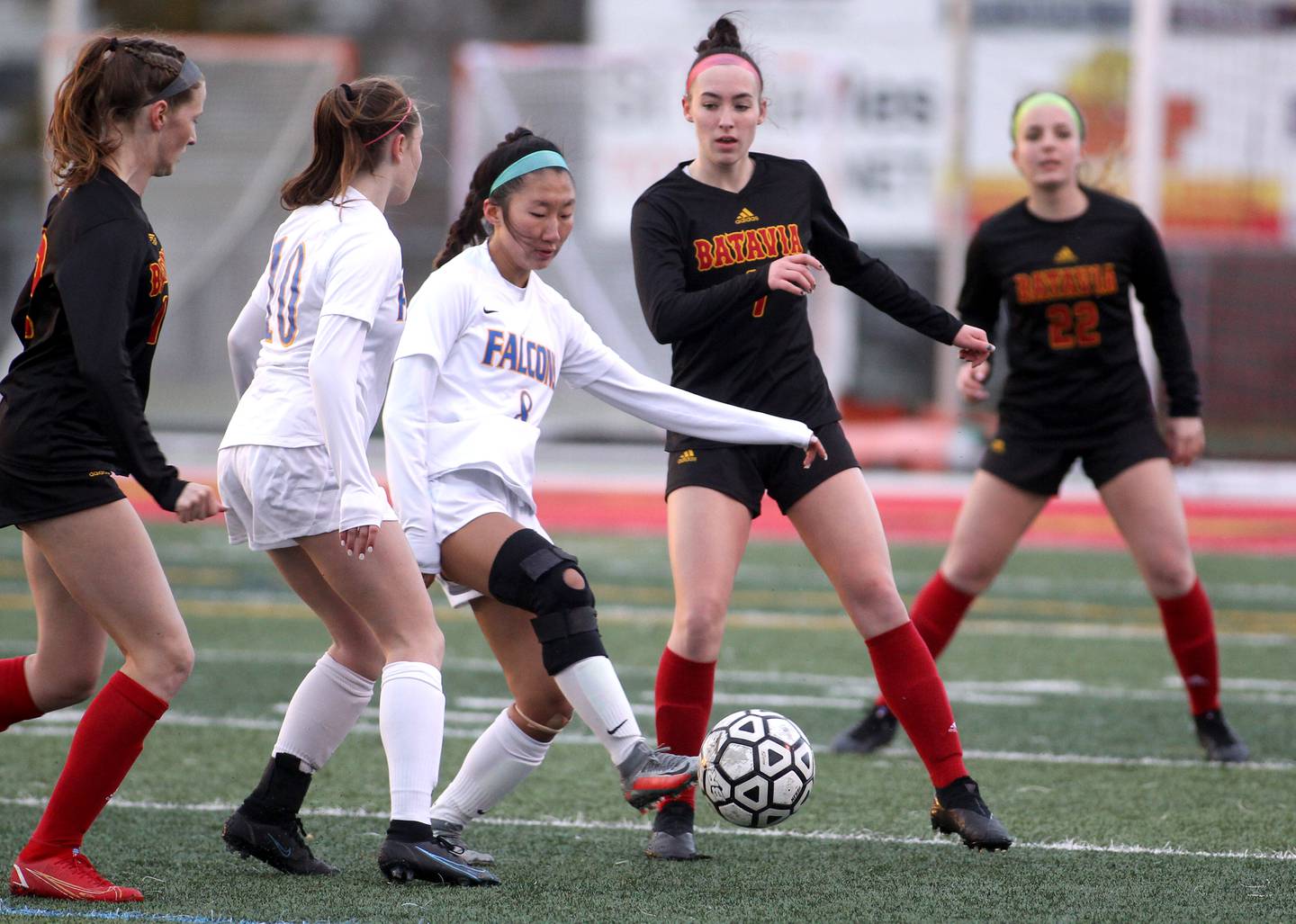 Wheaton North’s Claudia Kim (8) gets control of the ball during a game at Batavia on Thursday, April 7, 2022.