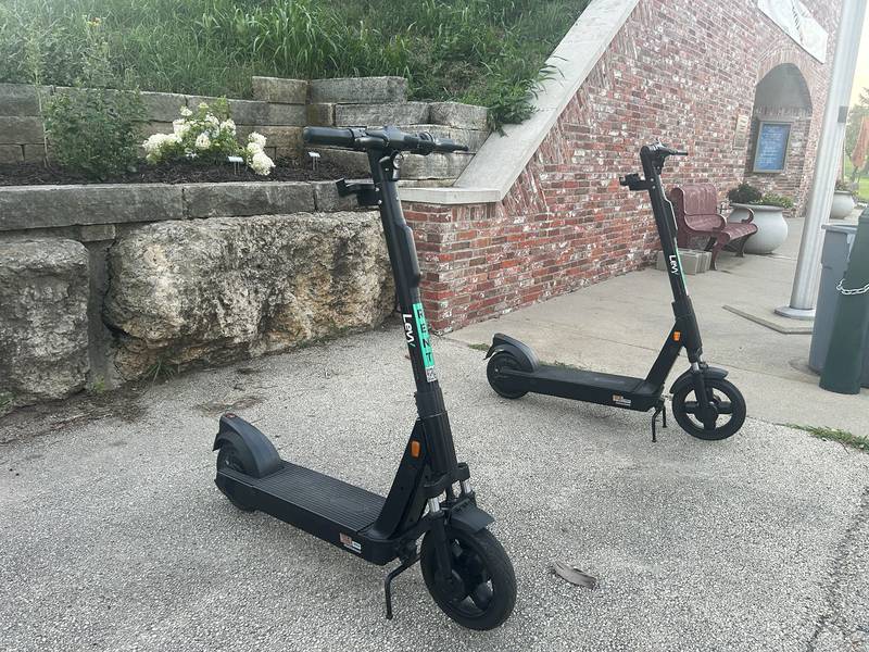Battery operated scooters wait for rides at the base of the de Immigrant Windmill in Fulton on Friday evening, July 18, 2025.