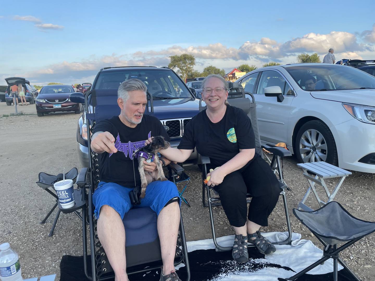 Chicagoans Ken Payne and Julie Connors brought their newly adopted pup, Charlie, to the McHenry Outdoor Theater July 26. While Payne snapped his fingers to try to draw Charlie's attention forward, Charlie only had eyes for Connors.