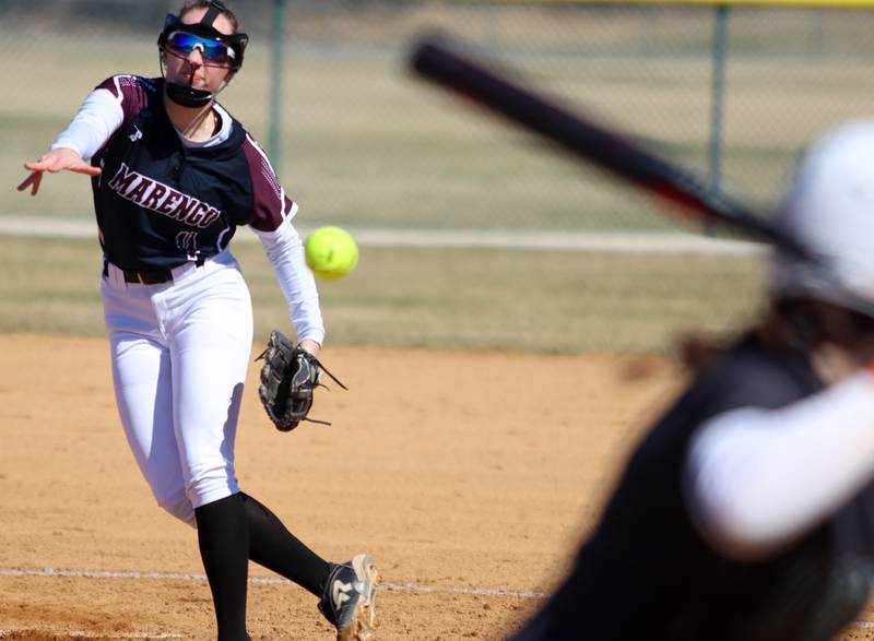 Marengo’s Jozsa Christiansen delivers against North Boone in varsity softball at Marengo High School in Marengo on Saturday, March 22, 2025.